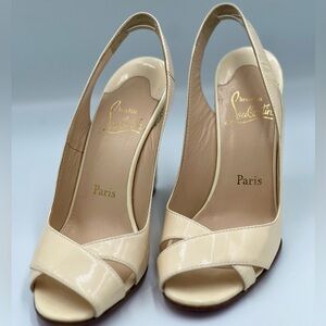 Christian Louboutin Cream Colored Peep-Toe Heels with Signature Red Sole